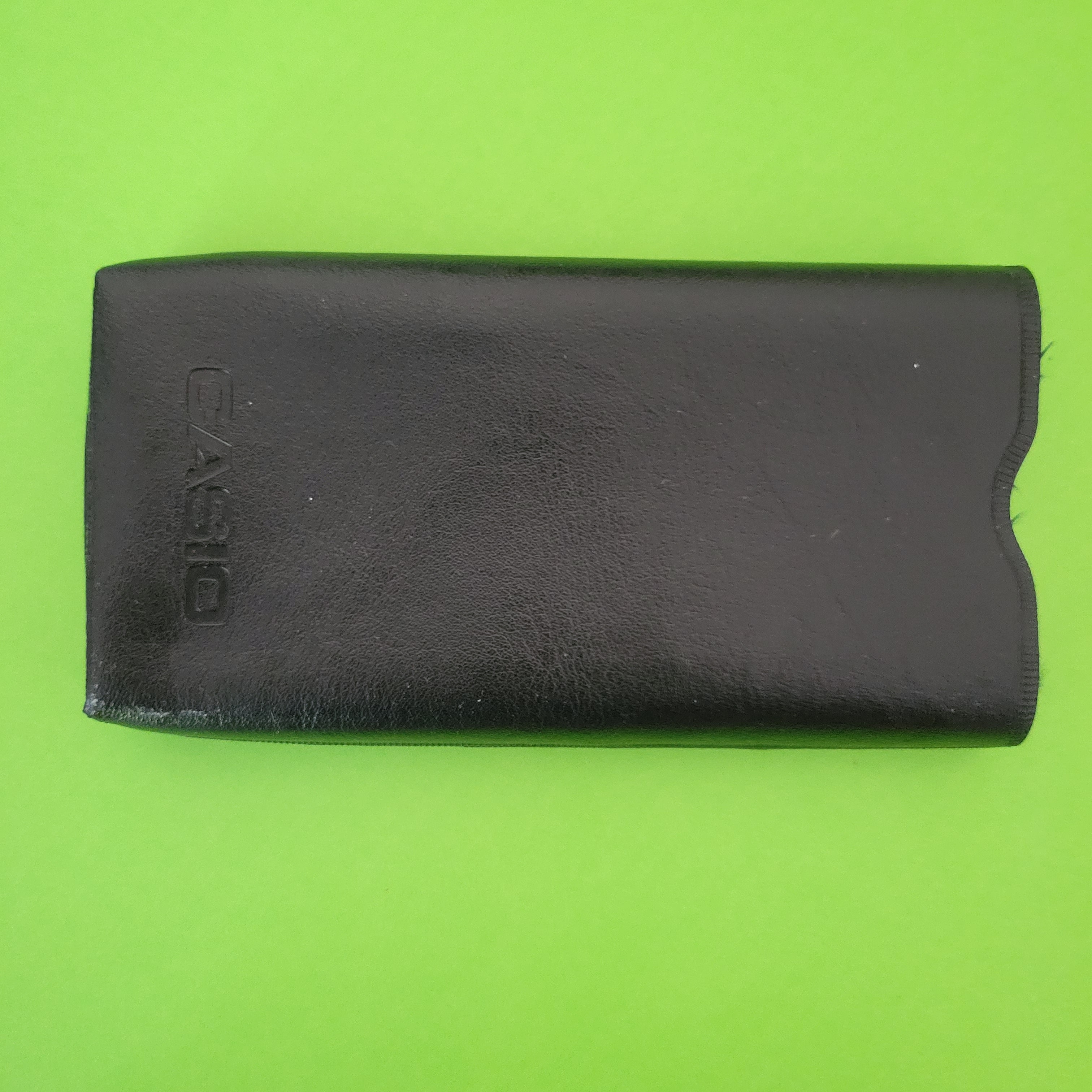 An image of the case of a Casio Memory-8R Four Function + calculator